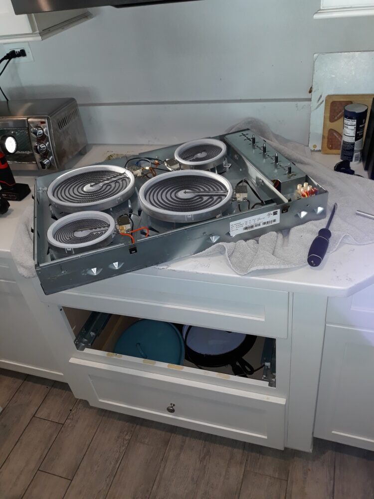 appliance repair cooktop repair repaired by replacement of the burnt coil  heating element with a new part trapnell ridge dr plant city fl 33567